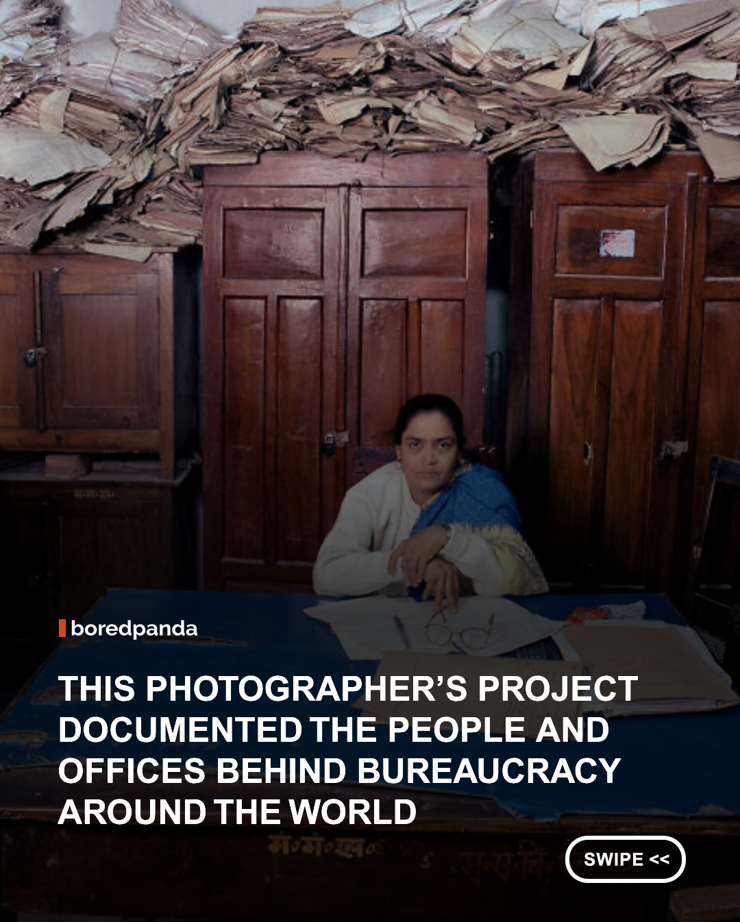 Bureaucracy exists almost everywhere, but step inside the offices where it actually happens, and the similarities quickly give way to striking differences. Desks, filing cabinets, portraits of political leaders, religious symbols, certificates, family photographs, and stacks of paperwork can reveal almost as much about a country as the officials sitting among them. Photographer Jan Banning explored exactly that idea with “Bureaucratics,” a long-running project documenting civil servants and government officials in their everyday workplaces around the world. Rather than focusing on politicians or imposing government buildings, Banning photographed the unelected officials who put laws and policies into practice, from administrators to police officers, and the environments where they do that work.  



#Photography #Art #JanBanning
